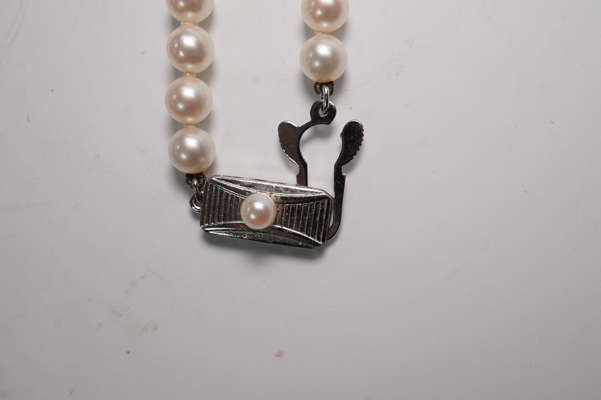 A Mikimoto single strand cultured pearl necklace, 36cm, with Mikimoto pouch. Condition - fair to good